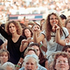 Lilith Fair concertgoers cheer ovaried singer Shawn Colvin.